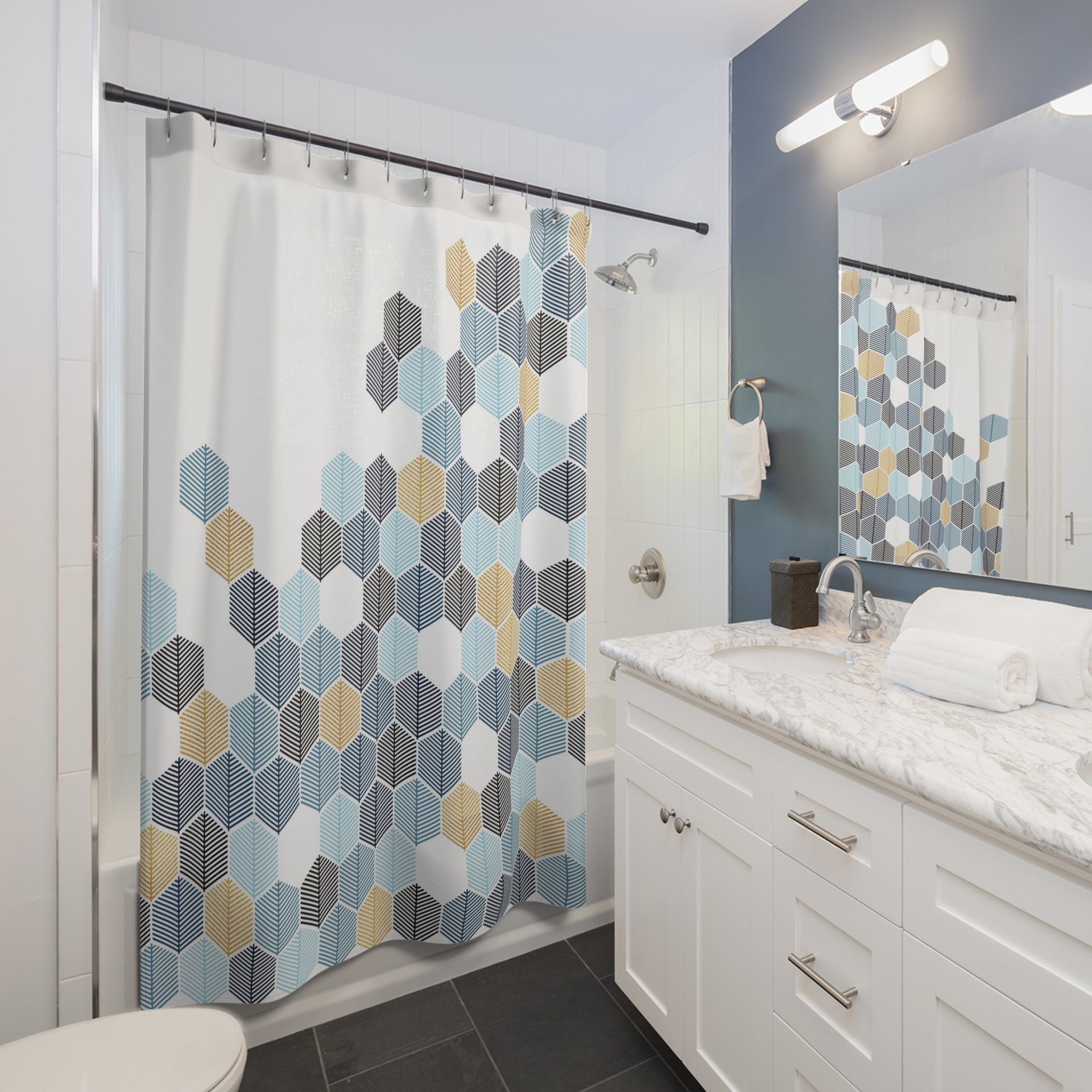 Abstract honeycomb-shaped trees design shower curtain in navy blue, rackley blue, light blue and gold (not glittery) on a white background in a small neutral bathroom