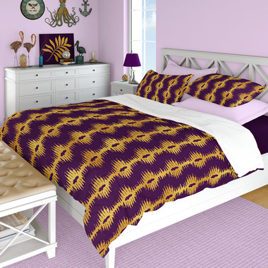 Purple with Gold bargello style Stripes queen duvet cover with matching pillow shams on a bed.