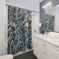 Abstract Geometric Shower Curtain, Blue, Gray and Sand in an apartment bathroom