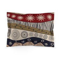 Standard pillow sham. Naive African elephants and giraffes artwork with primitive floral motifs in maroon, navy blue and earth tones.