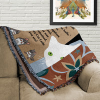 Cat blanket folded on a couch