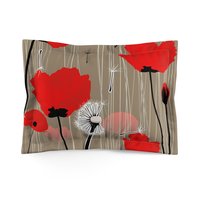 Standard size pillow shams with Red and pink flowers with black and white dandelion seed pods on a taupe background.