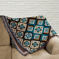 Southwestern Woven Cotton Blanket, Diamonds Pattern folded on a couch