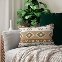 Geometric art in white, light teal, tan, and brown. Each side has a different Aztec design using the same color palette.