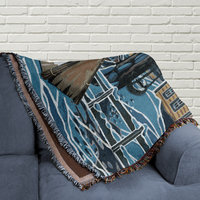 woven blanket folded on a couch