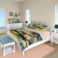 Water lily queen duvet cover with two pillow shams on a bed