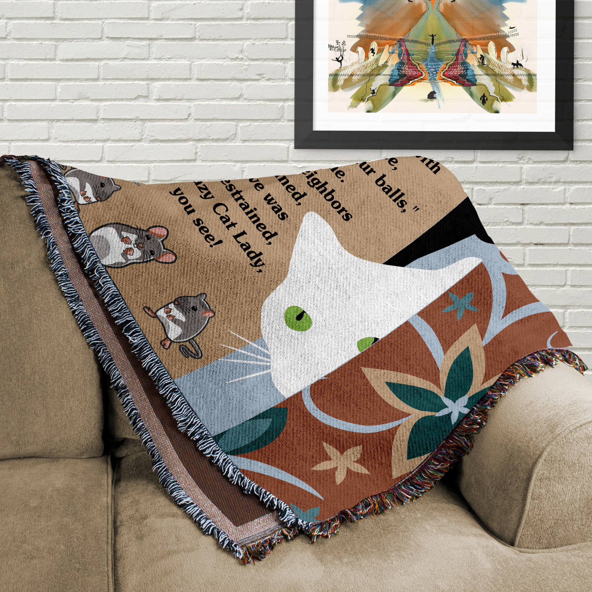 Cat blanket folded on a couch