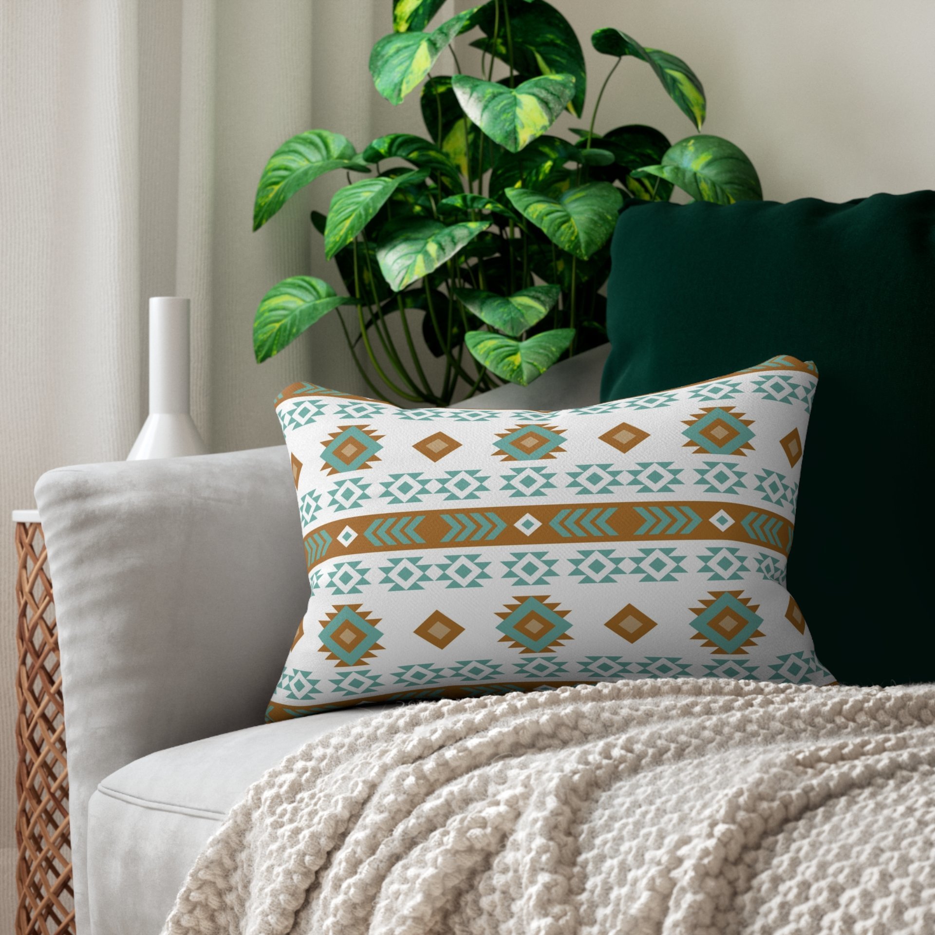 Geometric art in white, light teal, tan, and brown. Each side has a different Aztec design using the same color palette.