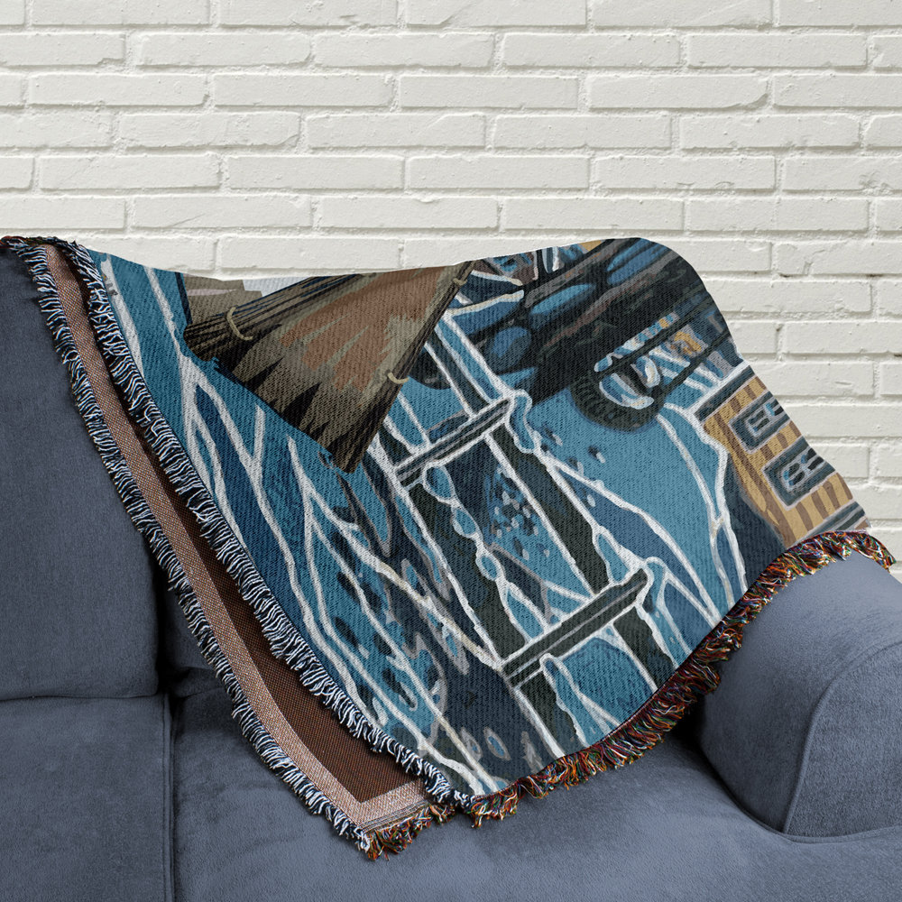 woven blanket folded on a couch