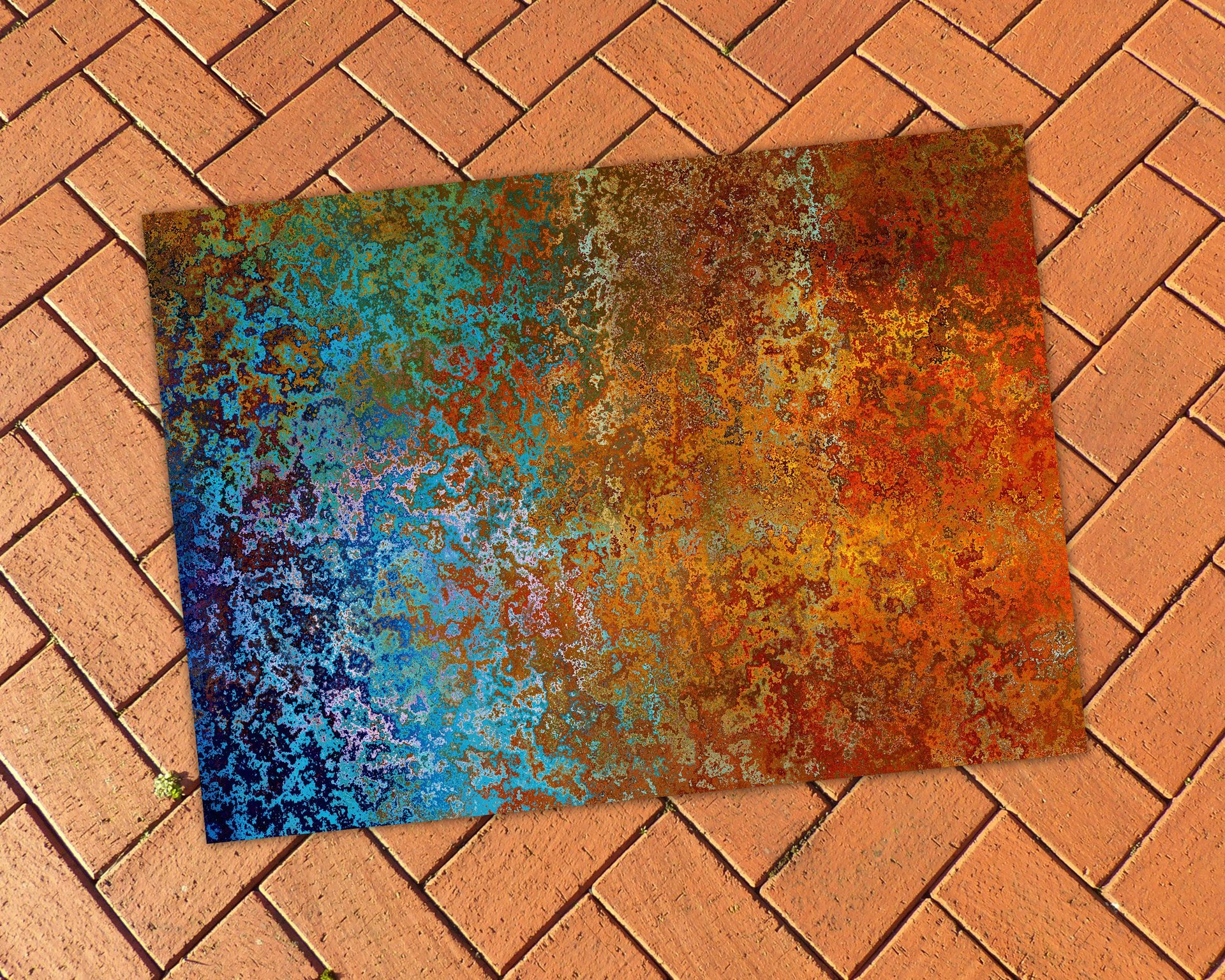 Abstract Ombré Rug in Southwestern Colors on a brick patio