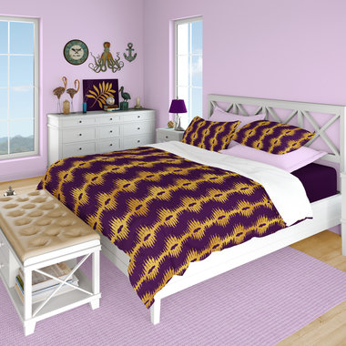 Purple with Gold bargello style Stripes queen duvet cover with matching pillow shams on a bed.