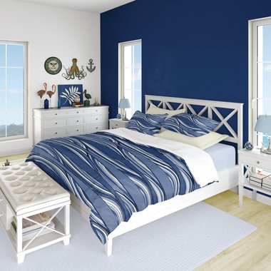 Blue waves queen duvet cover bedding set with pillow shams on a bed